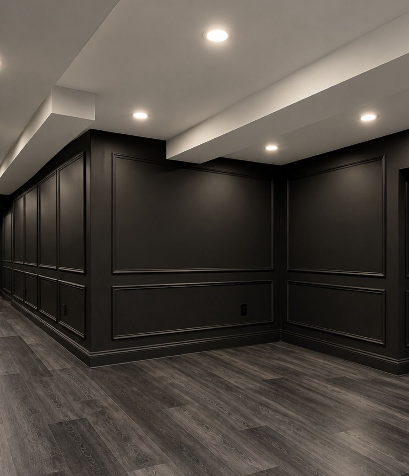Basement finishing with dark wainscoting feature wall and vinyl plank flooring by DK Construction Inc.