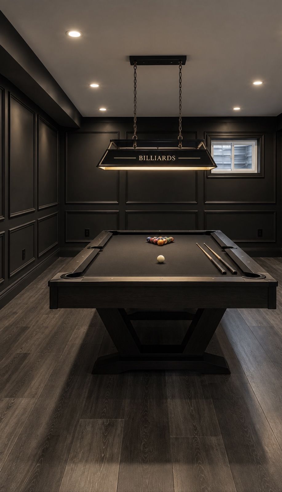 Finished basement billiards room with panelled walls and pendant lighting by DK Construction Inc.